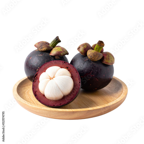 Mangosteen on wooden plate, fresh and vibrant
