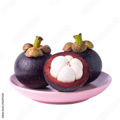 Mangosteens on pink plate, fresh and vibrant