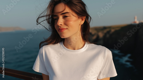 Plain White T-Shirt Worn By A Young Woman Outdoors With Ocean Background On A Sunny Day