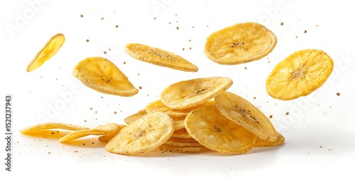 Crispy banana chips falling on white background