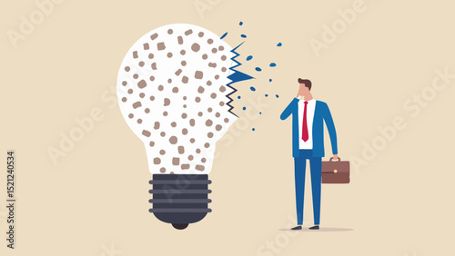 Businessman looking at broken lightbulb with scattered pieces representing a failed or lost idea concept
