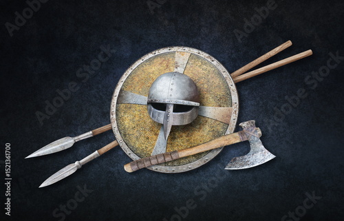 viking's helmet axe shield and two spears on grunge background