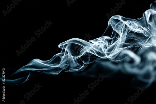 Abstract smoke swirls on a dark background with dramatic lighting.