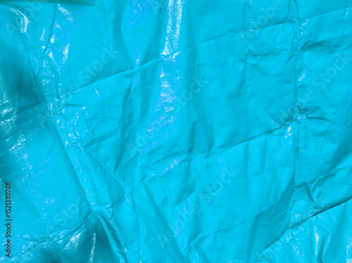 Blue background. Light blue tarpaulin PVC background. Blue aesthetic. Blue plane surface. Wrinkle texture. Reusable material. Tarp backdrop. Polymer. Polyvinyl chloride. Durable material. PVC canvas.