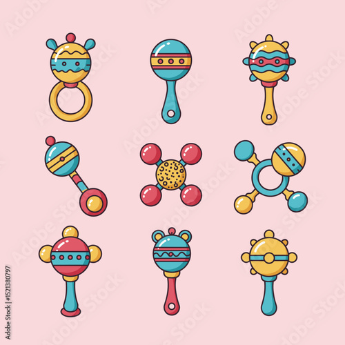 Colorful baby rattles in various designs arranged on pink background  