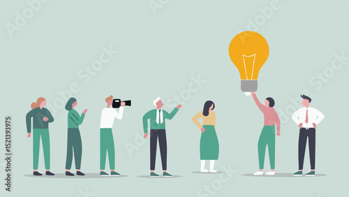 Group of people with one holding a large lightbulb representing an idea and a photographer present
