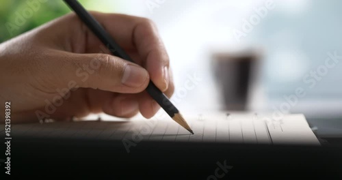 Close-Up Handwriting on Paper with Pencil in Daylight