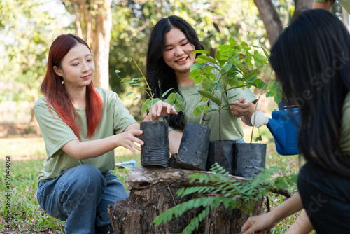 The volunteers show responsibility and teamwork as they collaborate to plant trees and care for plants. Their efforts support sustainability and conservation, helping earth thrive. Volunteer concept