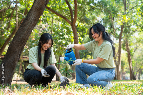 The volunteers show responsibility and teamwork as they collaborate to plant trees and care for plants. Their efforts support sustainability and conservation, helping earth thrive. Volunteer concept