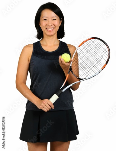 A smiling woman with shoulder-length hair holds a tennis racket and wears a black sleeveless top and skirt.