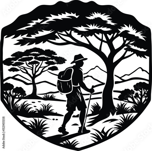Silhouette of a Hiker Walking Through a Forest with Mountains in the Background