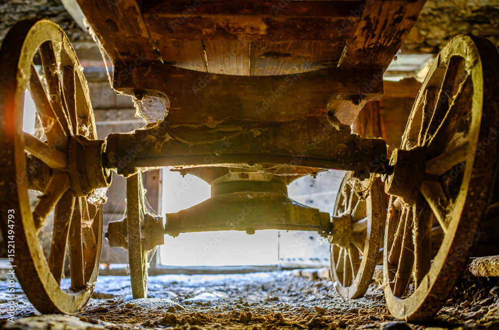 custom made wallpaper toronto digitalVintage wooden cart with large wheels resting on a dusty floor in a rustic barn environment during the late afternoon light