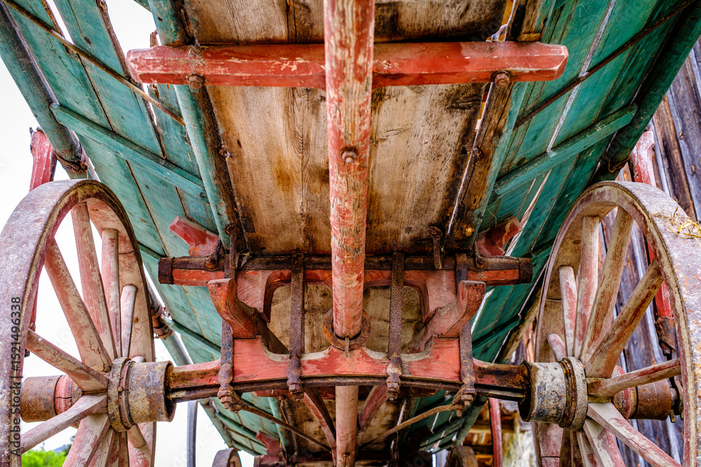 custom made wallpaper toronto digitalVintage wooden cart with large wheels resting on a dusty floor in a rustic barn environment during the late afternoon light