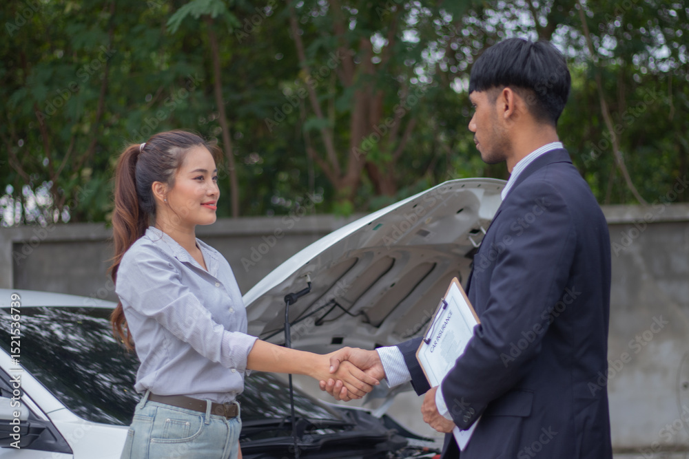 Hands of young insurance agent and female car owner holding hands beside car to make successful deal on topic of finance, insurance, partnership and mutual trust. Hands of young insurance agent and female car owner holding hands beside car to make successful deal on topic of finance, insurance, partnership and mutual trust.