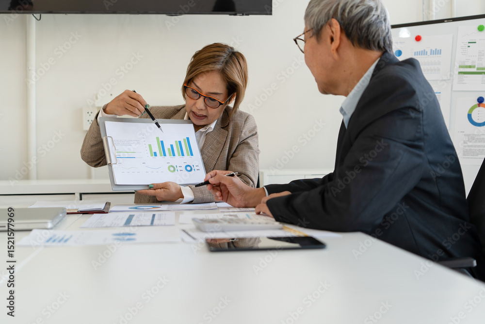 Fototapeta premium Senior businessmen analyzing data.