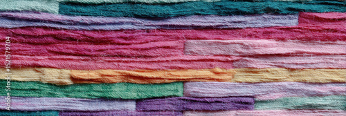 Colorful rugs woven from recycled fabric strips create vibrant pattern