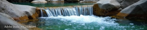Refreshing cool water cascading over smooth, grey stones in a natural spring, creating a tranquil and serene atmosphere Crystal clear, icy cold, pure, natural, flowing water , crystal, calm
