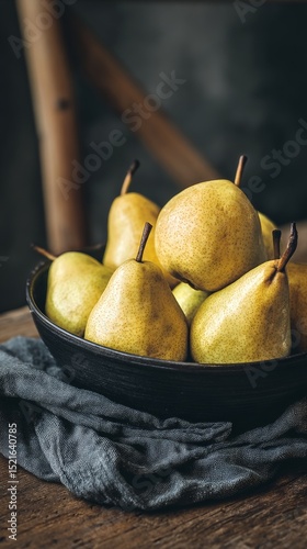 Fresh Yellow Pears Arranged in a Black Bowl on a Rustic Wooden Table