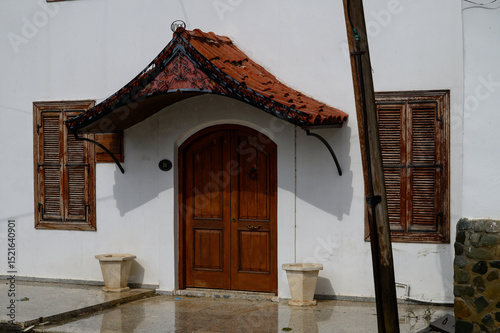 Old traditional wooden entrance doors of a house in Cyprus.