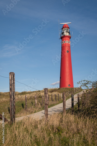 postcard with ed lighthouse and path on the coast ot the dutch island of schiermonnikoog photo