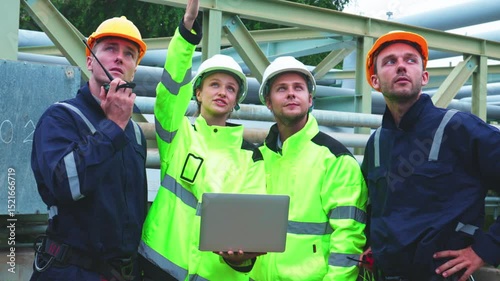 Engineers Reviewing Data at Industrial Site at Night