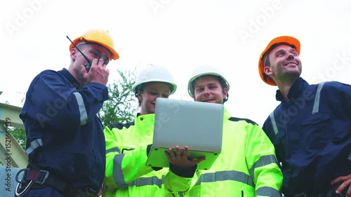 Engineers Reviewing Data at Industrial Site at Night