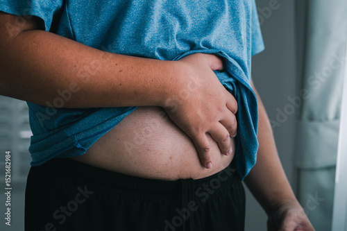 Hand belly health awareness action home lifestyle image indoor personal reflection