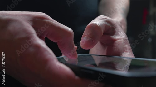 sending sms.
A man in a chat writes a text message and sends it.
Close-up of the smartphone keyboard.
A man uses a mobile phone for correspondence