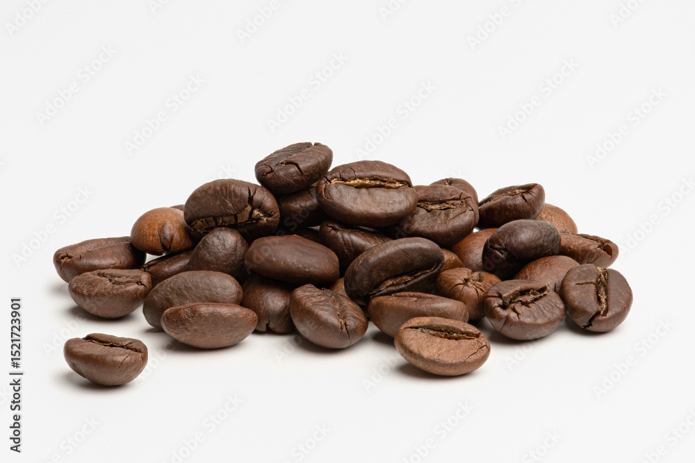 A pile of coffee beans on a white background