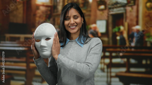 Photography Woman holding mask inside church smiling removing mask showing face latin female