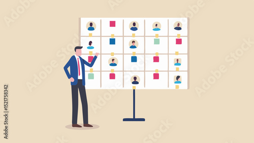 Man in suit presenting a board with headshots and colored squares in a light beige background