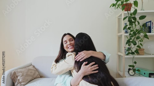 Therapist supporting patient with sincere hug during therapy session