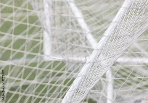 Close up of soccer net draped around the goal