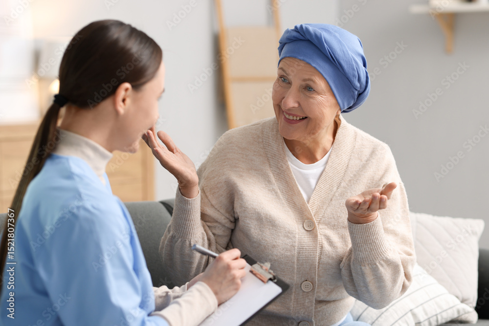 Fototapeta premium Woman with cancer and nurse at home