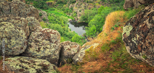 panoramic view to canyon with granite stones and water source