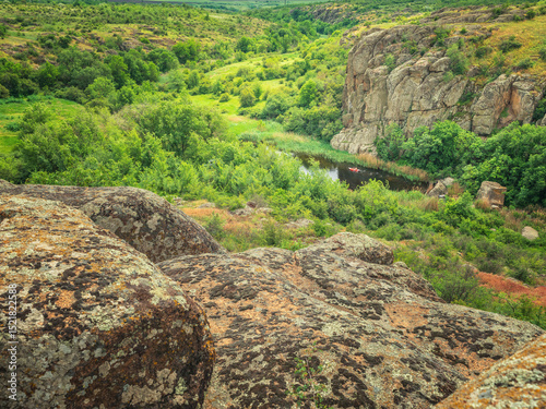 panoramic view to canyon with kayak on river