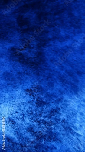 Abstract flowing texture of deep blue rippled water and fine lines, creating a hypnotic, dreamlike ocean movement in a blurred effect.