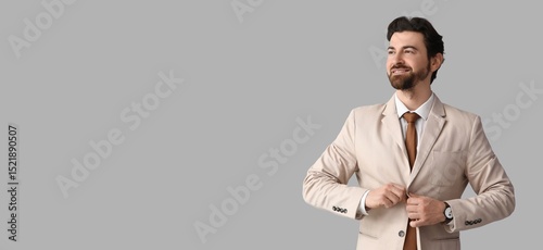 Handsome man in stylish sui...