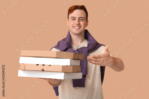 Young man holding cardboard...