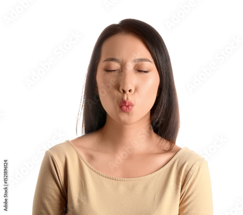Fotografi Portrait of pretty young Asian woman blowing kiss on white background
