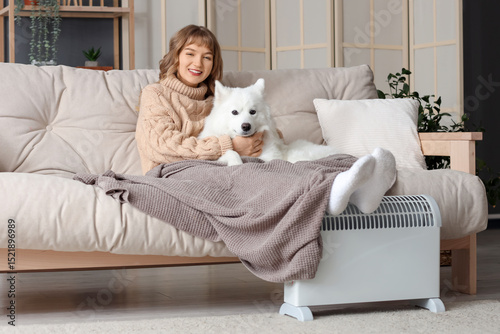 Young woman with blanket an...