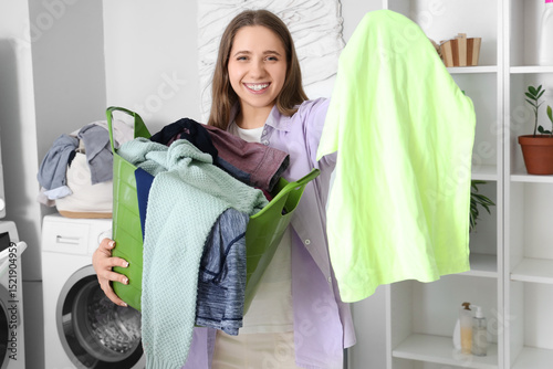 Young woman holding basket ...
