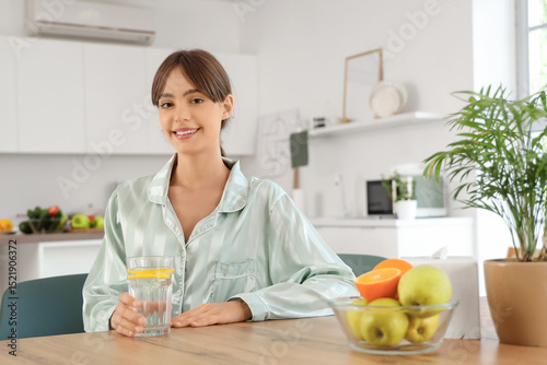 Young woman with glass of l...