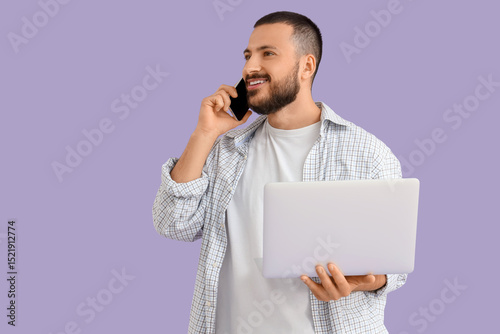 Young man with laptop talki...
