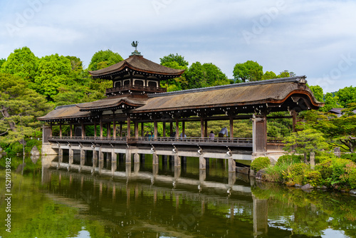 Taihei-kaku, a wooden covered bridge in the garden of Heian Jingu Shrine in Kyoto, Japan