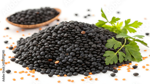 Background pile of healthy dried small round black lentils seeds stacked together.