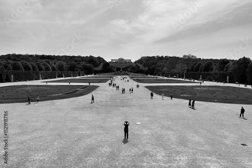 Distant person taking pictures of the gardens 