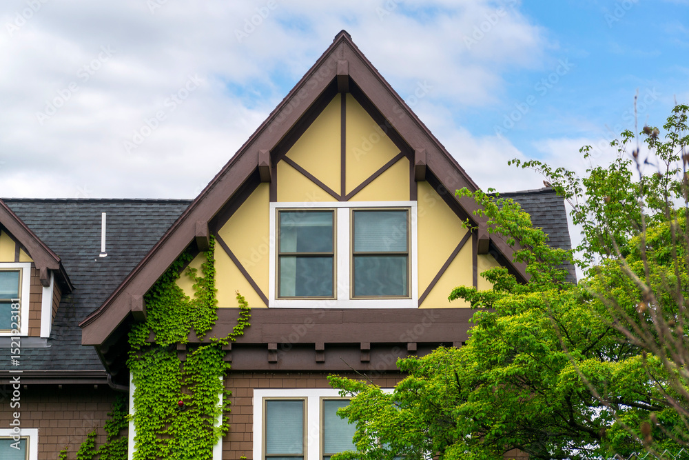Elegant Tudor-style gabled facade with double windows and ivy wall in Brighton, Massachusetts, USA
Elegant Tudor-style gabled facade with double windows and ivy wall in Brighton, Massachusetts, USA