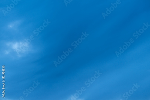 Subtle Smears of Thin Clouds Across Blue Sky