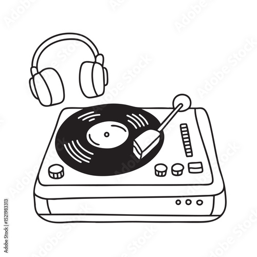 A turntable beside a pair of headphones